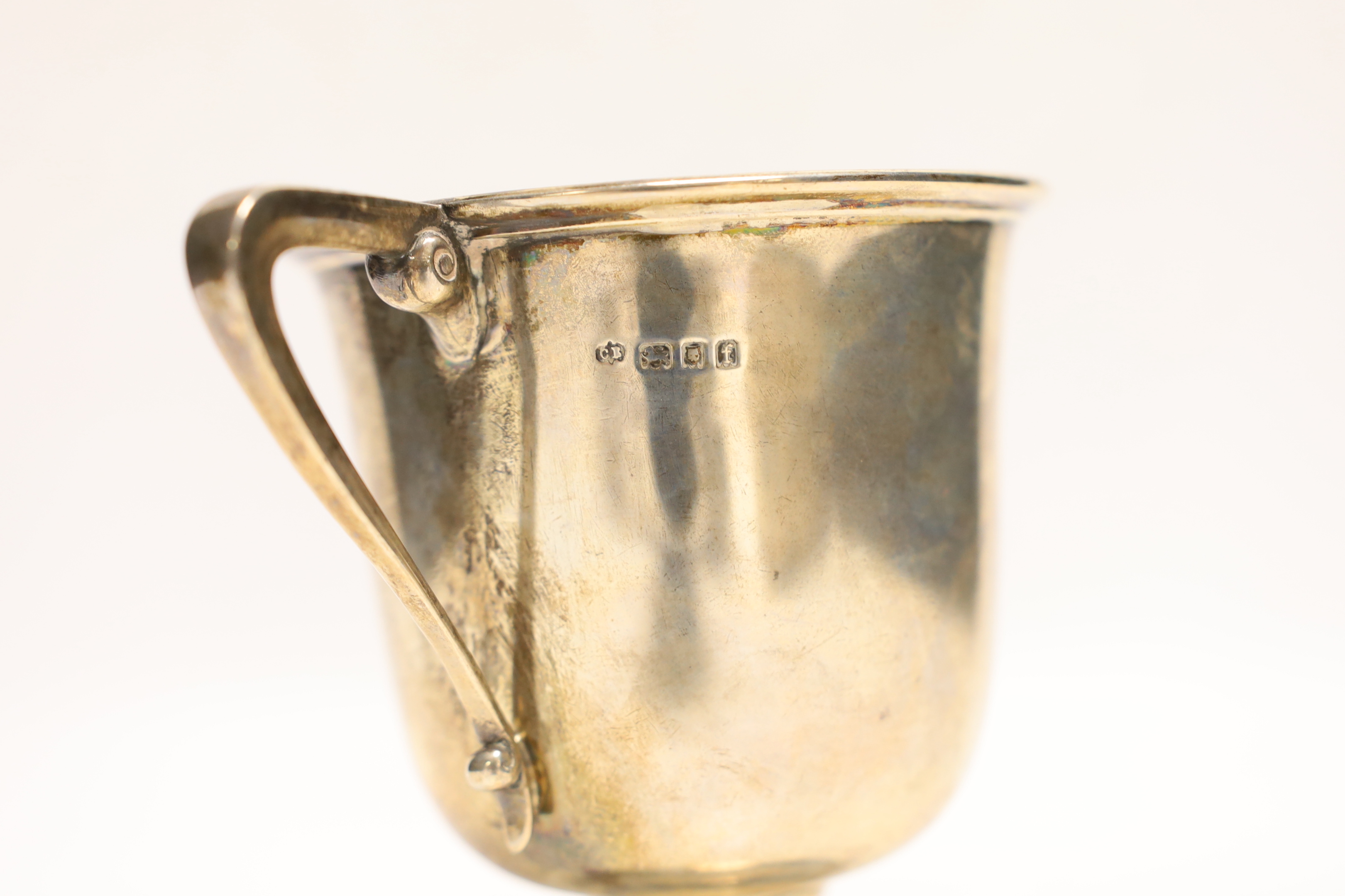 A George V silver two handled trophy cup, Charles Edwards, London, 1921, 12.2cm, 8.4oz.